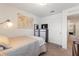 Functional bedroom with a single bed, a world map wall hanging, and a dresser with a TV at 943 Grandin St, Davenport, FL 33837