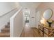 Inviting foyer with light wood floors and staircase leading to the upper level at 943 Grandin St, Davenport, FL 33837