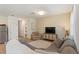 Open-concept living room with modern furnishings and bright, airy ambiance at 943 Grandin St, Davenport, FL 33837