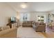 Bright living room with a large comfortable sectional sofa and modern entertainment center at 943 Grandin St, Davenport, FL 33837