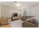 Comfortable living room with neutral tones, plush seating, and natural light at 943 Grandin St, Davenport, FL 33837