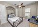 Comfortable bedroom with a ceiling fan, a window, and a well-appointed design at 961 Christina Chase Dr, Lakeland, FL 33813