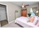 Bedroom featuring neutral decor, canopy bed, and television at 961 Christina Chase Dr, Lakeland, FL 33813