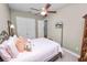 Comfortable bedroom with a ceiling fan, closet space, and a stylish wall-mounted television at 961 Christina Chase Dr, Lakeland, FL 33813