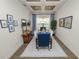 Bright dining room with coffered ceiling, stylish chandelier, and decor at 961 Christina Chase Dr, Lakeland, FL 33813