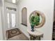 Welcoming foyer features elegant decor, tiled floors, and ample natural light at 961 Christina Chase Dr, Lakeland, FL 33813