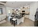 Modern kitchen with black granite island and updated appliances at 961 Christina Chase Dr, Lakeland, FL 33813