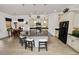Contemporary kitchen featuring a black granite island, dining area, and modern appliances at 961 Christina Chase Dr, Lakeland, FL 33813