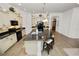 Spacious kitchen with island and bar stools, complemented by modern appliances and decorative accents at 961 Christina Chase Dr, Lakeland, FL 33813