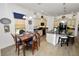 Charming kitchen with island seating, updated appliances, and adjacent dining area at 961 Christina Chase Dr, Lakeland, FL 33813