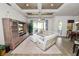 Open-concept living room with a large sectional, entertainment center, and access to the dining area at 961 Christina Chase Dr, Lakeland, FL 33813