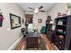 Spacious home office featuring a ceiling fan, an area rug, and shelving for ample storage at 961 Christina Chase Dr, Lakeland, FL 33813