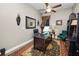 Well-appointed home office with a ceiling fan, decorative rug, and a comfortable workspace at 961 Christina Chase Dr, Lakeland, FL 33813