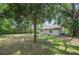 Spacious backyard featuring lush greenery and ample space for outdoor activities at 1133 Bryn Mawr Ave, Lake Wales, FL 33853