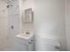 Well-lit bathroom with shower, single vanity, and modern toilet at 1133 Bryn Mawr Ave, Lake Wales, FL 33853
