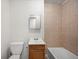 Bathroom featuring a tiled shower, vanity, toilet, and clean finishes at 1133 Bryn Mawr Ave, Lake Wales, FL 33853
