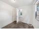 Bright bedroom with closet featuring new carpet, neutral paint and an AC unit at 1133 Bryn Mawr Ave, Lake Wales, FL 33853