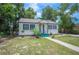 Inviting single Gathering home featuring lush landscaping and a cozy front porch at 1133 Bryn Mawr Ave, Lake Wales, FL 33853