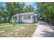 Charming single-story home featuring classic design with a well-maintained yard and long driveway at 1133 Bryn Mawr Ave, Lake Wales, FL 33853