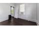 Bedroom featuring a window and radiator unit on hardwood floors at 121 F Sw Ave, Winter Haven, FL 33880