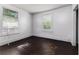 Bedroom with two windows and an air conditioning unit at 121 F Sw Ave, Winter Haven, FL 33880
