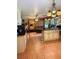 Open-concept kitchen flows into a cozy living space, perfect for entertaining at 1216 W Lake Buckeye Dr, Winter Haven, FL 33881