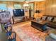 Comfortable living room shows a TV, bar seating, and cozy seating area at 1216 W Lake Buckeye Dr, Winter Haven, FL 33881