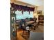Cozy living room with detailed window treatments, comfortable seating, and an elegant area rug at 1216 W Lake Buckeye Dr, Winter Haven, FL 33881