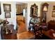 Elegant living room featuring classic furniture, including a wooden desk and a stylish display case at 1216 W Lake Buckeye Dr, Winter Haven, FL 33881