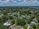 Overhead shot showcases a residential area surrounded by lush greenery, highlighting its peaceful setting at 1232 Fairlee St, Lakeland, FL 33813