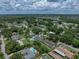Aerial view of a residential property with lush green landscaping and mature trees at 1232 Fairlee St, Lakeland, FL 33813