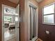 Hall bathroom with a shower stall and view of the Primary bedroom at 1232 Fairlee St, Lakeland, FL 33813
