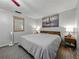 Spacious bedroom features carpet, art, and two side tables with lamps at 1232 Fairlee St, Lakeland, FL 33813