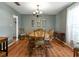 Inviting dining room area with an oval table, chandelier, and matching chairs at 1232 Fairlee St, Lakeland, FL 33813