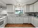 Beautiful kitchen offers stainless appliances, marble countertops, and white cabinetry at 1232 Fairlee St, Lakeland, FL 33813