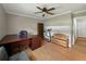 Spacious home office or study with a desk, shelving, and a ceiling fan at 1232 Fairlee St, Lakeland, FL 33813