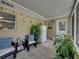 The covered patio is furnished with comfortable seating, plants, and string lights, creating a relaxing outdoor space at 1232 Fairlee St, Lakeland, FL 33813