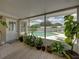 Screened-in patio with plants, a view of the pool, and easy access to the backyard and outdoor amenities at 1232 Fairlee St, Lakeland, FL 33813