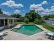 Refreshing pool surrounded by lush landscaping and comfortable lounging areas at 1232 Fairlee St, Lakeland, FL 33813