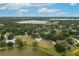 Lakefront property aerial view highlighting waterfront access, mature trees, and serene setting at 21 Lake Ave, Winter Haven, FL 33880