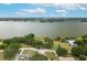 Aerial view of a waterfront home nestled among trees overlooking a serene lake at 21 Lake Ave, Winter Haven, FL 33880