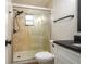 Updated bathroom features a glass enclosed shower and modern fixtures at 21 Lake Ave, Winter Haven, FL 33880
