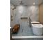 Luxurious bathroom with freestanding tub, rainfall shower, and stylish tile work at 21 Lake Ave, Winter Haven, FL 33880
