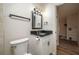 Updated bathroom features a modern vanity with a black countertop at 21 Lake Ave, Winter Haven, FL 33880