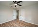 Bedroom features light walls and wood-look flooring at 21 Lake Ave, Winter Haven, FL 33880