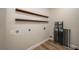 Laundry room with shelving and wood-look flooring at 21 Lake Ave, Winter Haven, FL 33880