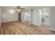 Main bedroom with LVP floors, a ceiling fan, a barn-door closet, and an updated bathroom with a glass shower at 21 Lake Ave, Winter Haven, FL 33880