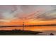 Picturesque waterfront view at sunset, with stunning colors reflecting on the tranquil water at 21 Lake Ave, Winter Haven, FL 33880