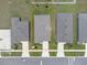 Aerial view featuring the home's roof, driveway, and yard within a well-maintained neighborhood setting at 221 Hilltop Bloom Loop, Haines City, FL 33844