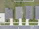 Aerial view featuring the home's roof, driveway, and yard within a well-maintained neighborhood setting at 221 Hilltop Bloom Loop, Haines City, FL 33844